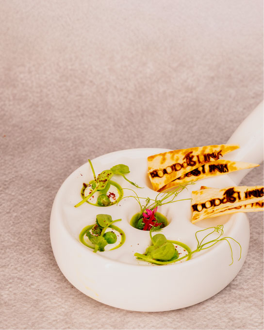 Plated gourmet dish on white platter