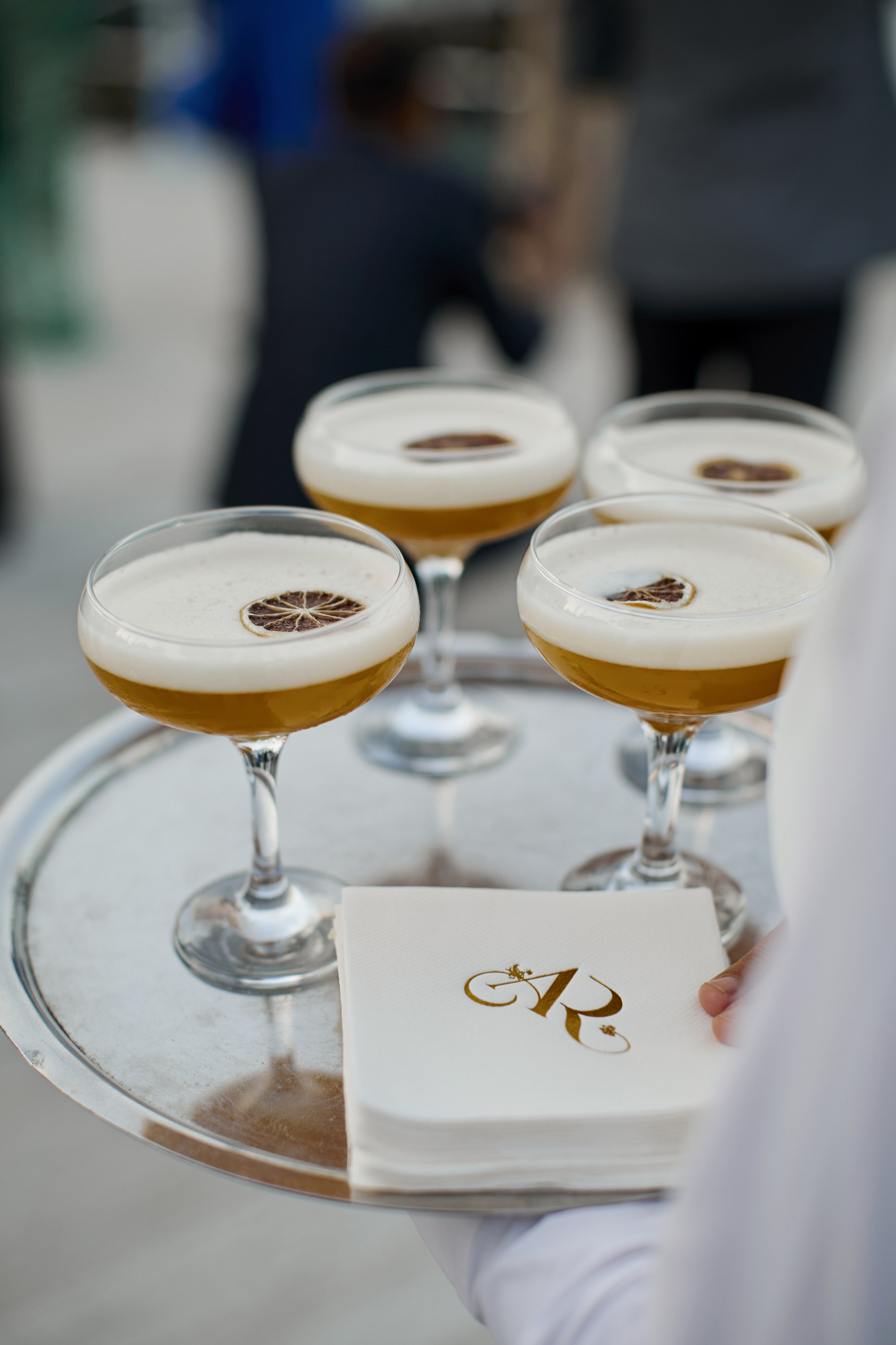 Tray with coupe glasses and monogrammed napkins