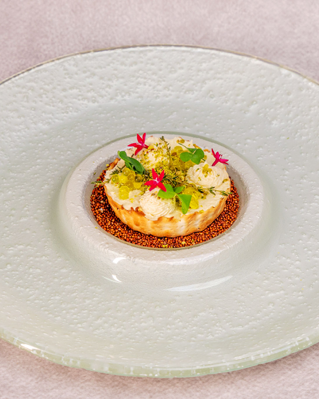 Exquisitely plated dish with elegant garnishes